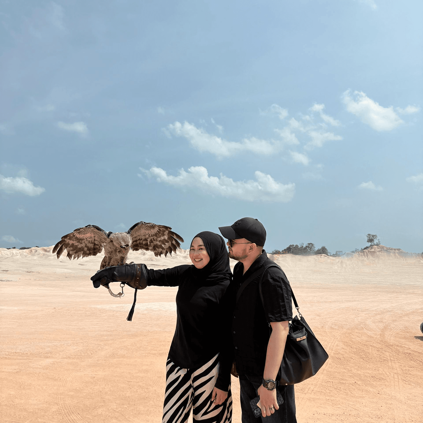 Travelers taking photos at sand dunes